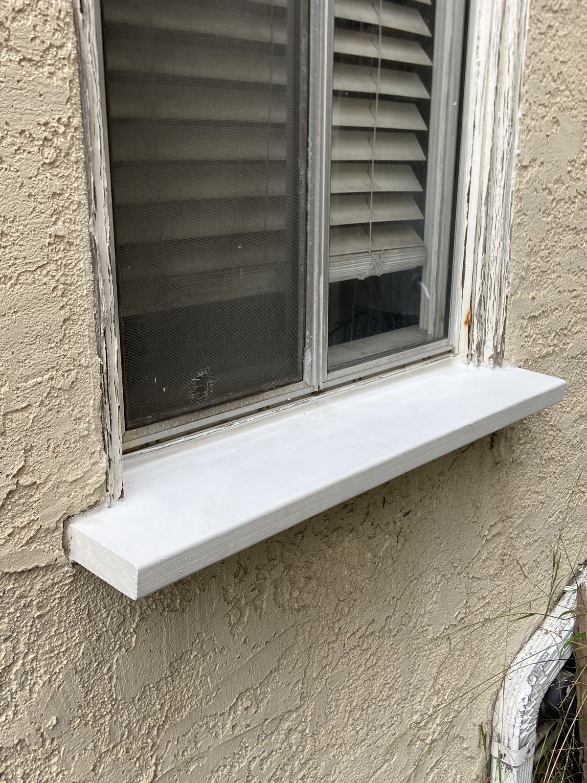 Exterior window sill repair and repaint, before and after