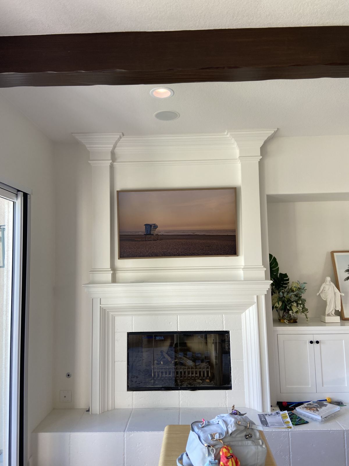 TV mounted above fireplace with laser-level alignment, Corona CA